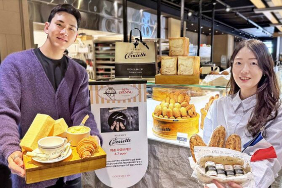 Models introduce the premium French butter brand La Conviette at the first Maison La Conviette branch in Korea at Hanwha Galleria, which opened in April. [HANWHA GALLERIA] 