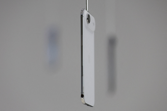 An iPhone Air hangs during Apple's event at the Steve Jobs Theater on its campus in Cupertino, California, U.S. Sept. 9, 2025. [REUTERS/YONHAP]