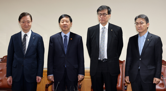 Government and financial authorities are seen during a meeting on macroeconomic and financial issues at the Korean Federation of Banks building in Jung District, central Seoul, on March 19. From left, Financial Supervisory Service Gov. Lee Chan-jin, Finance Minister Koo Yun-cheol, Bank of Korea Gov. Rhee Chang-yong and Financial Services Commission Vice Chairman Kwon Dae-young. [NEWS1]